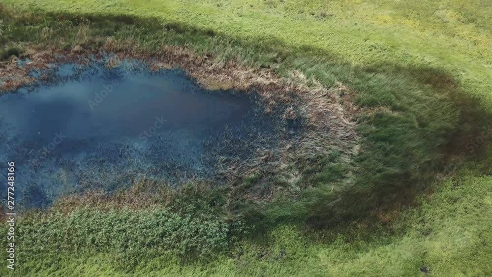 Flying above flooded field or swamp by drone copter aerial Flying above flooded field or swamp by drone copter aerial