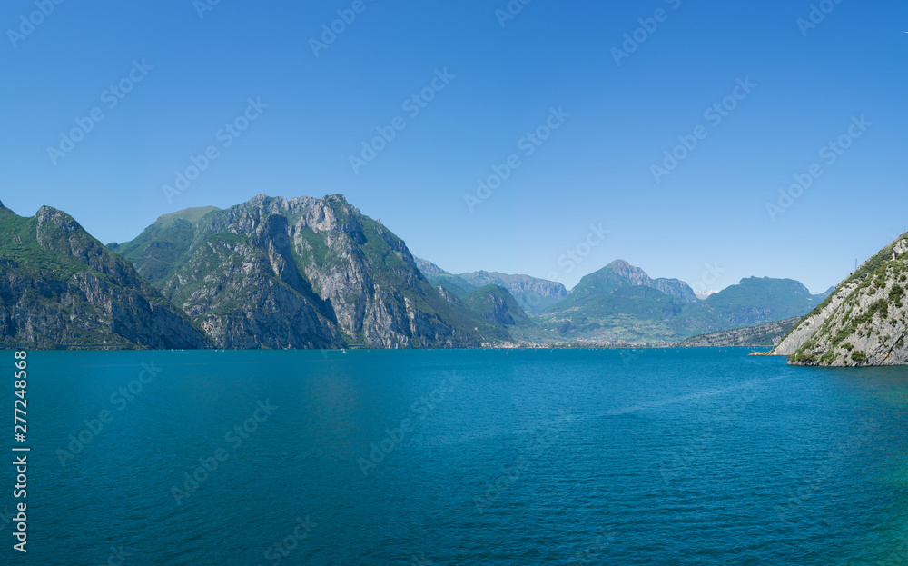 Beautiful panoramic view of Lago Di Garda coastline. Riva Del Garda and Nago-Torbole towns, Italy