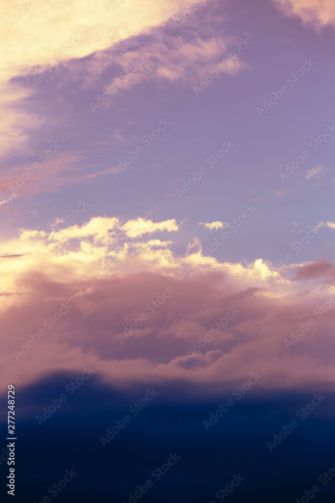 dark blue clouds at pink sunset