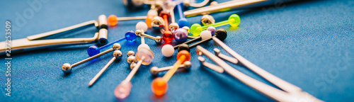 Bilde på lerret Body piercing background jewelry rings puncturing implants | Blurry Background