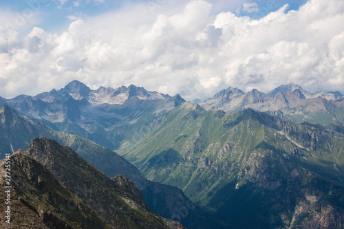 Mountains scene with dramatic cloudy sky in national park of Dombay