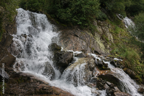 Fototapeta Naklejka Na Ścianę i Meble -  Closeup view waterfall scene in mountains, national park of Dombay, Caucasus