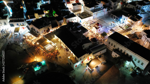 Aerial drone night shot from iconic illuminated main town of Mykonos island  Cyclades  Greece