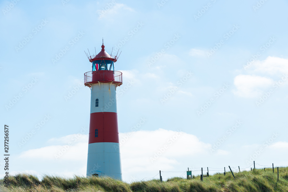 Lighthouse red white on dune. Sylt island – North Germany. Lighthouse red white on dune. Sylt island – North Germany.