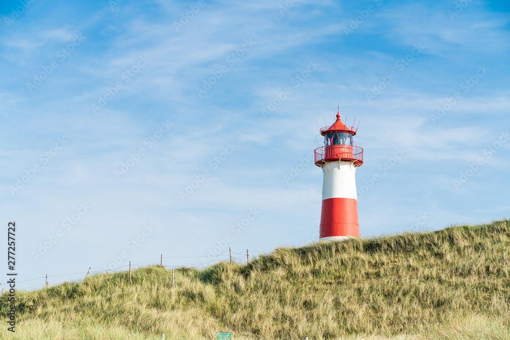 Lighthouse red white on dune. Sylt island – North Germany. Lighthouse red white on dune. Sylt island – North Germany.