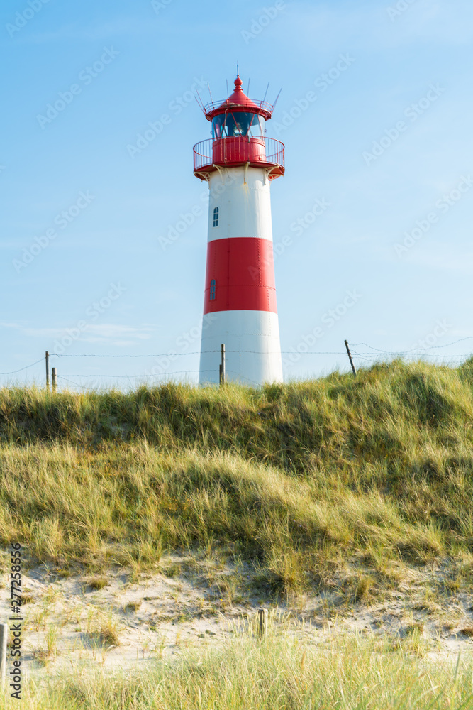 Lighthouse red white on dune. Sylt island – North Germany.  