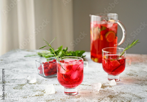 Glasses of tasty summer cocktail on table
