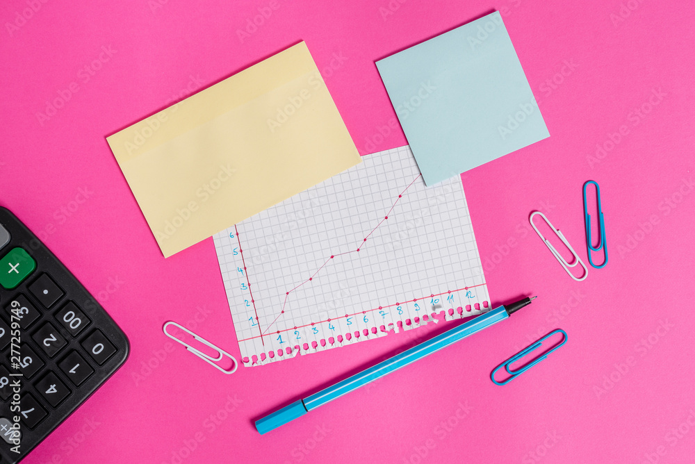 Stationary and note paper plus math sheet with diagram picture on the table Stationary and note paper plus math sheet with diagram picture on the table