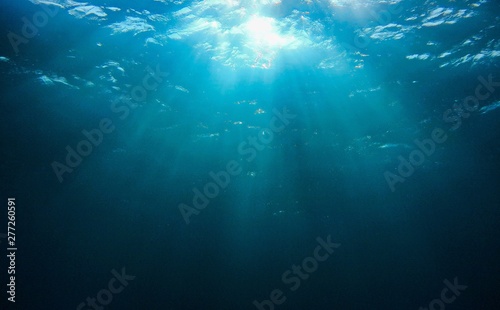 Underwater background of sunrays 