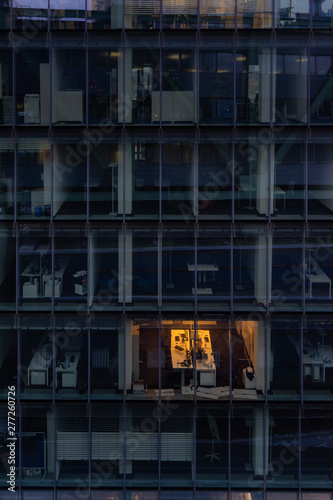 working late: single illuminated office at night