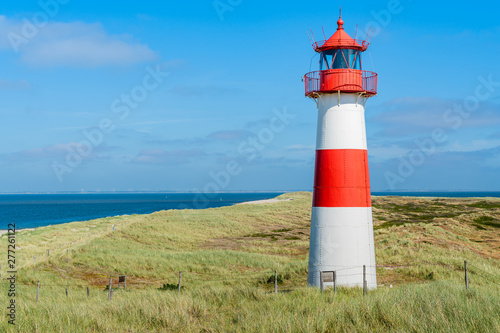 Lighthouse red white on dune. Sylt island – North Germany. 