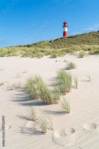 Lighthouse red white on dune. Sylt island – North Germany.  