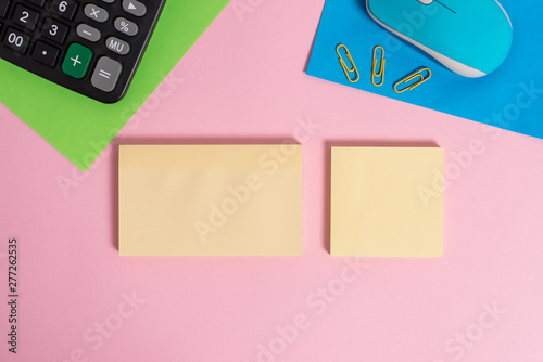 Wire mouse portable calculator notepads paper sheets clips color background photo