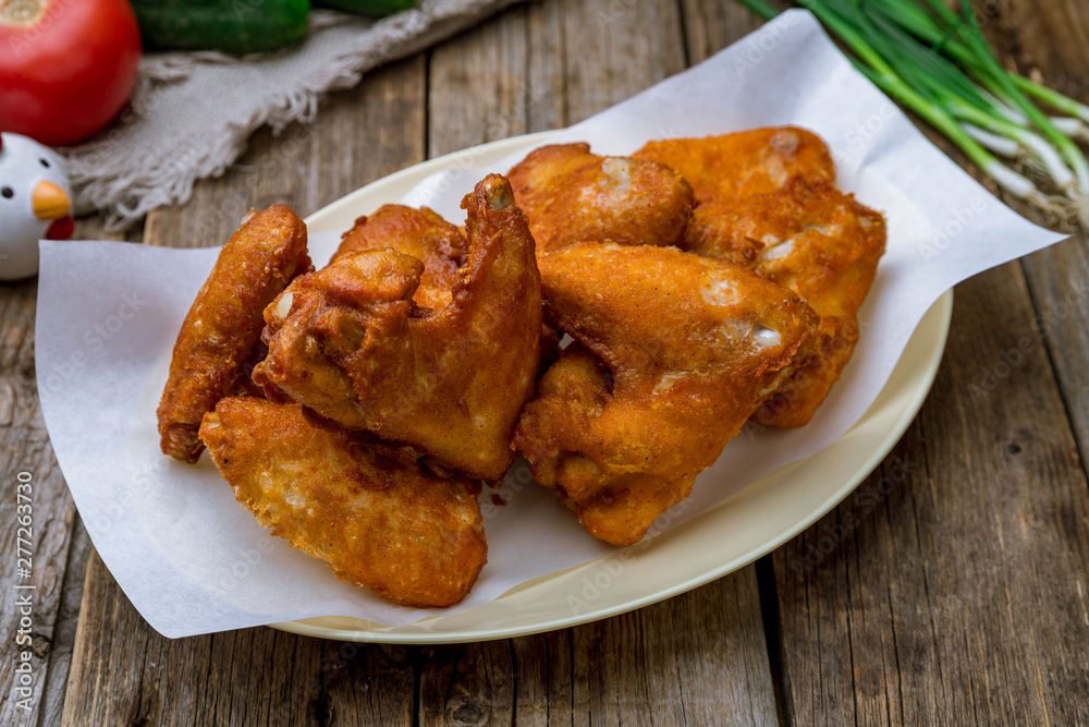 Buffalo chicken wings on a wooden background Buffalo chicken wings on a wooden background