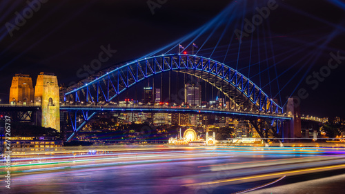 Sydney Harbour Bridge and Sydney Harbour lit up with colorful lights at the Vivid Festival © Andrew Atkinson
