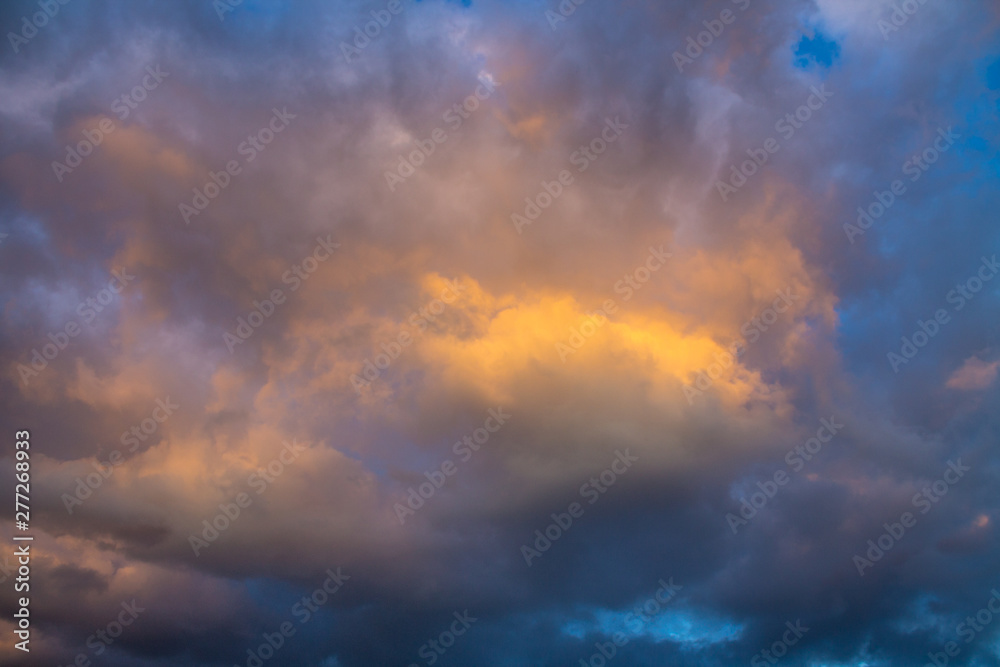 Beautiful sky at sunset with colored clouds