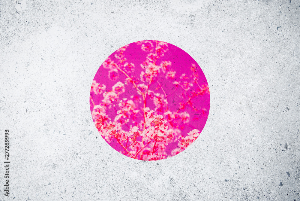 Decorative grunge Japanese flag background with pink cherry blossom image on textured urban concrete wall - obrazy, fototapety, plakaty 