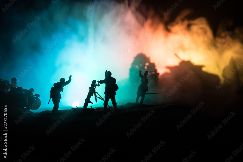 Obraz premium War Concept. Military silhouettes fighting scene on war fog sky background,