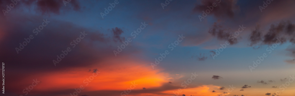 Naklejka premium Dramatic Panoramic View of a cloudscape during a cloudy and colorful sunset. Taken over Beach Ancon in Trinidad, Cuba.