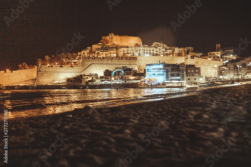 Night view of Peñiscola Mediterranean town of the province of Castellon, Spain and Papa Luna Castle photo