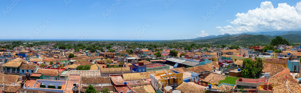 Aerial panoramic view of a small touristic Cuban Town during a sunny and cloudy summer day. Taken in Trinidad, Cuba.