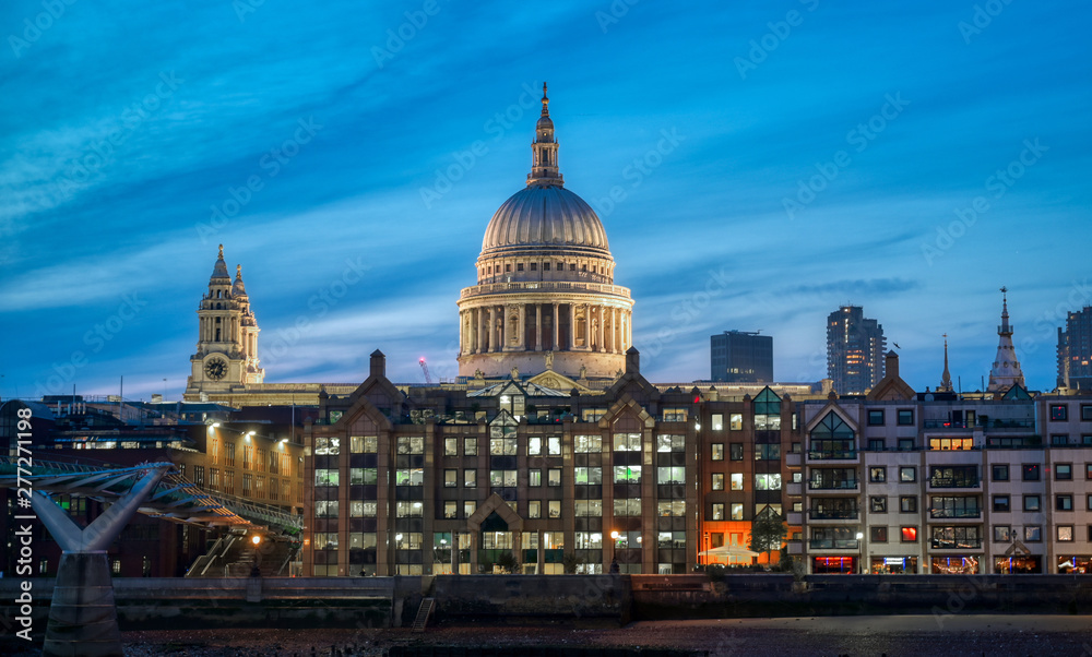 St. Paul's Cathedral across Millennium Bridge and the River Thames in London, UK.
