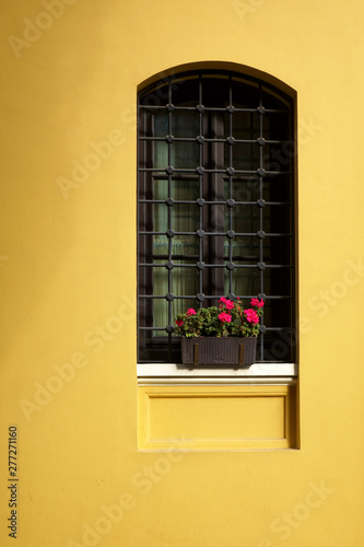 Photography close up yellow building exterior with retro style window in Istanbul, Turkey