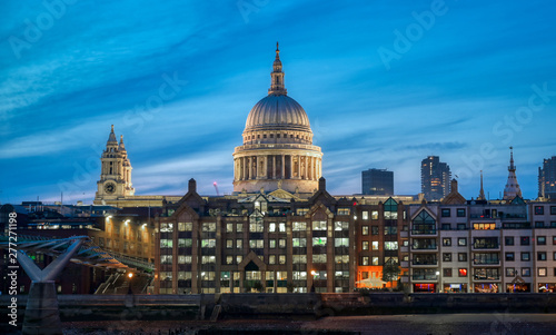 St. Paul's Cathedral across Millennium Bridge and the River Thames in London, UK. © Jbyard