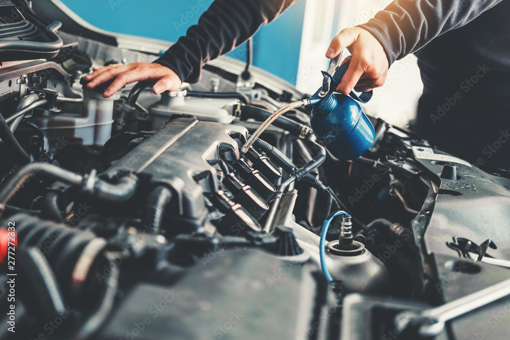 Fototapeta premium Technician Hands of car mechanic working in auto repair Service and Maintenance car