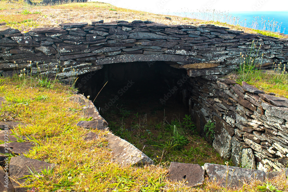 Close-up of an ancient stone house at the Orongo archaeological site on Easter Island, showcasing intricate details of its traditional architecture and cultural significance.
