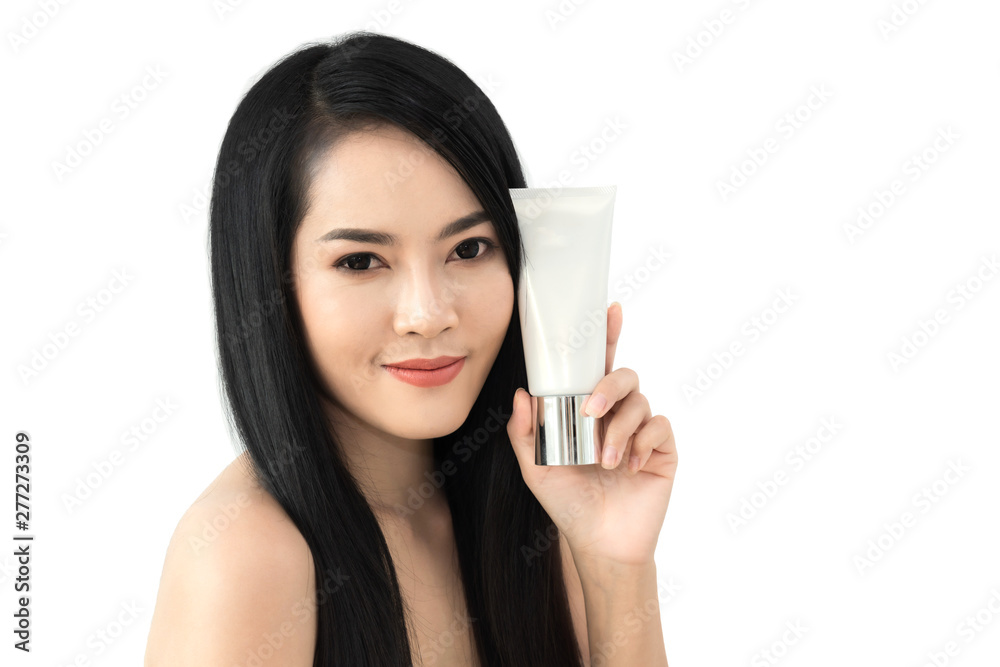 Beautiful young woman showing skincare products presenting with copy space isolated on white background Beautiful young woman showing skincare products presenting with copy space isolated on white background