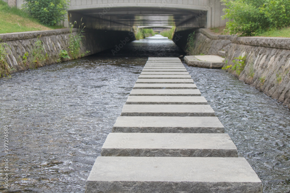 Concrete block walkway or footpath in Sosei river nearly the park at Sapporo City, Hokkaido, Japan. Concrete block walkway or footpath in Sosei river nearly the park at Sapporo City, Hokkaido, Japan.