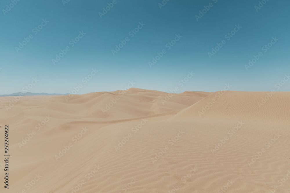 sand dunes with blue sky
