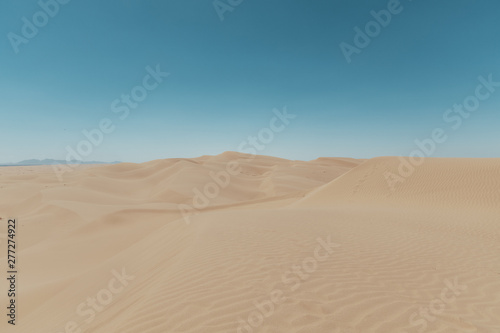 sand dunes with blue sky