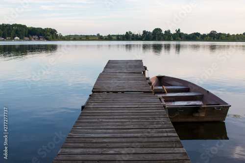 Wallpaper Mural Rowboat on lake attached to a dock Torontodigital.ca