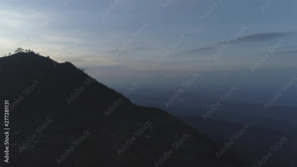 Cinematic drone shot - Revealing the skyline above a mountain Cinematic drone shot - Revealing the skyline above a mountain