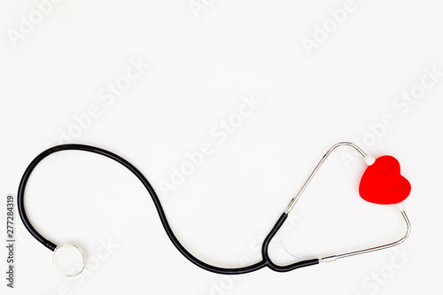 Stethoscope, Top view of stethoscope and red heart on white background, Red heart and stethoscope isolated on white background,medical doctor desk concept.