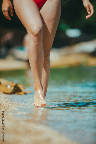 woman legs walking by seaside close up © phpetrunina14