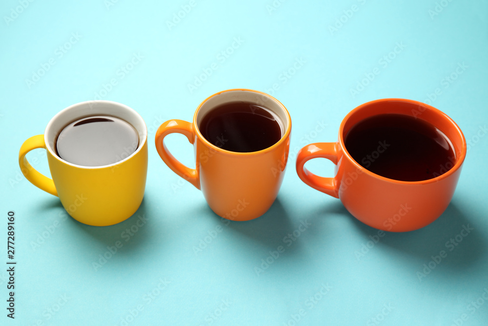 Black tea (coffee) in bright cups, office break, team building. Black tea (coffee) in bright cups, office break, team building.