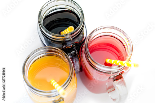 Fresh purple green yellow orange red e in jar