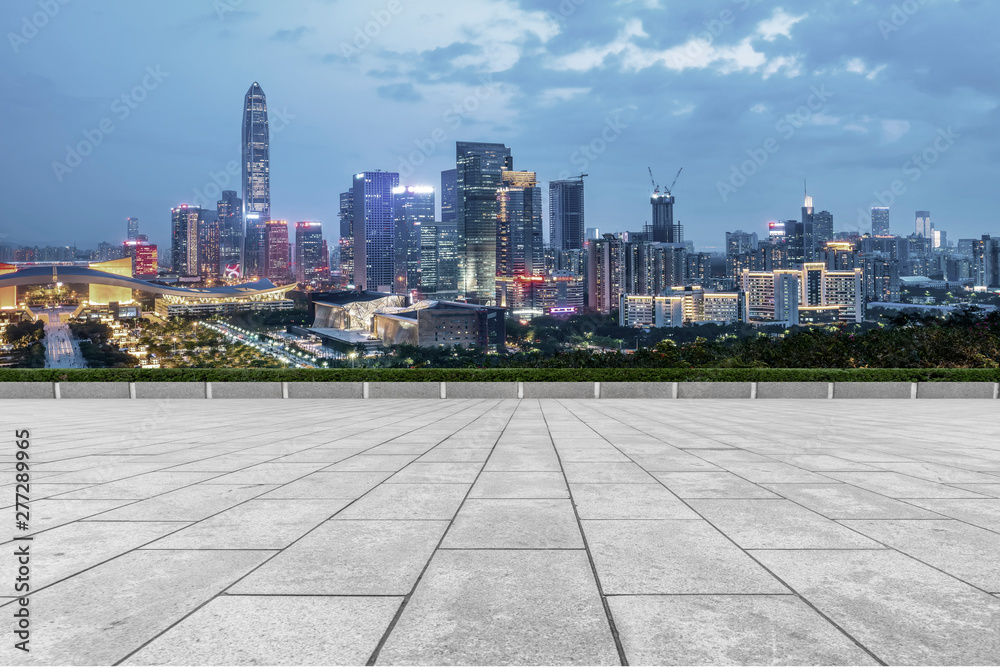 Empty square tiles and skyline of urban Architecture