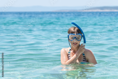 Woman with snorkeling mask dive in the sea
