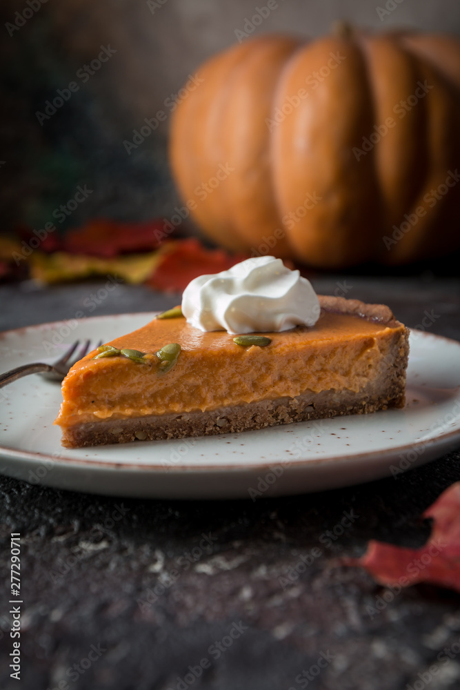 Slice of Festive Homemade Pumpkin Pie with Whipped Cream Slice of Festive Homemade Pumpkin Pie with Whipped Cream