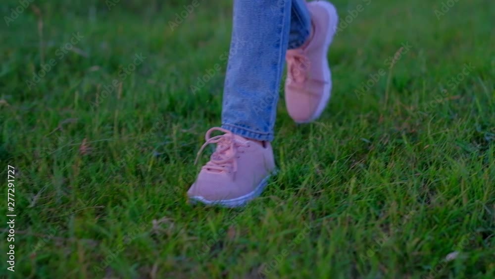 close up - legs of a woman with yellow socks, walking along the autumn trail, tourist walks in nature. close up - legs of a woman with yellow socks, walking along the autumn trail, tourist walks in nature.