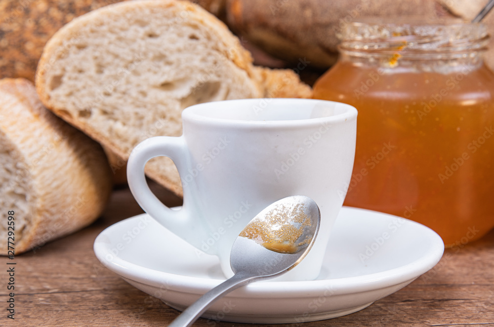 Healthy breakfast eating coffee, bread, orange jam, on white wooden table. Healthy breakfast eating coffee, bread, orange jam, on white wooden table.