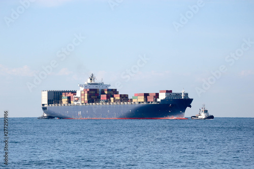 Large cargo container ship in harbor of Livorno, Italy