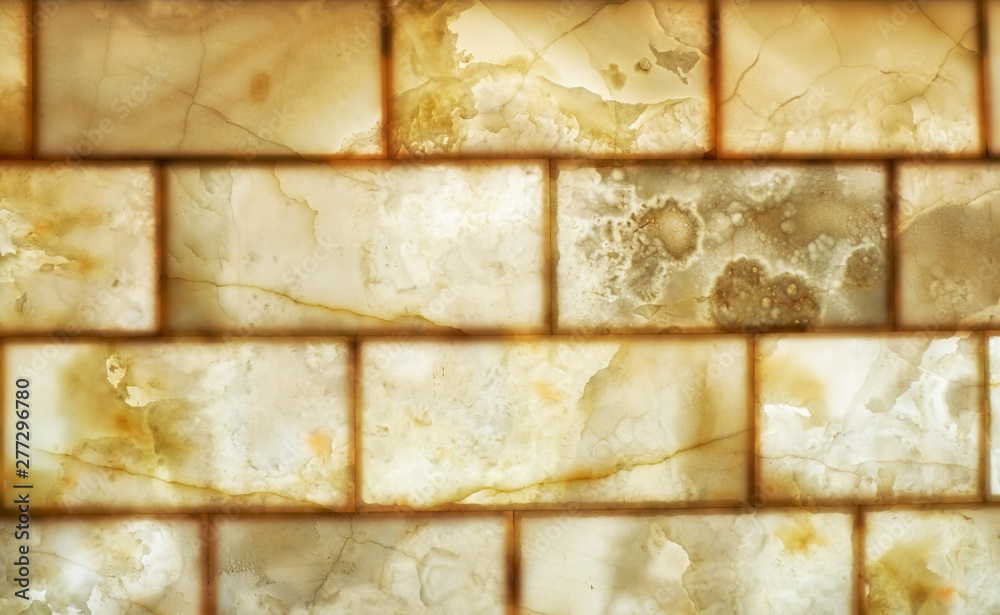Onyx brick wall background. Texture of honey color onyx material Onyx brick wall background. Texture of honey color onyx material