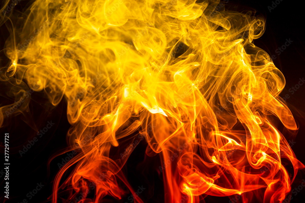 Fototapeta premium Colored smoke on black background
