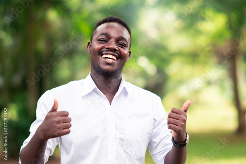 African man smiling with all rignt sign photo