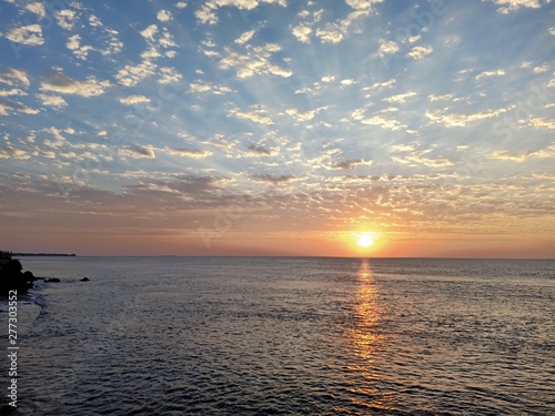 sunset over sea © Irsyad